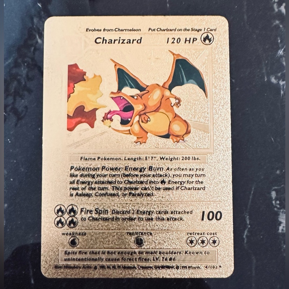 Charizard Gold Foil Pokémon card FRESH out of the box
